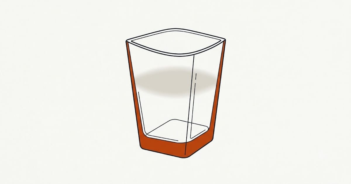 A glass with a white film after washing